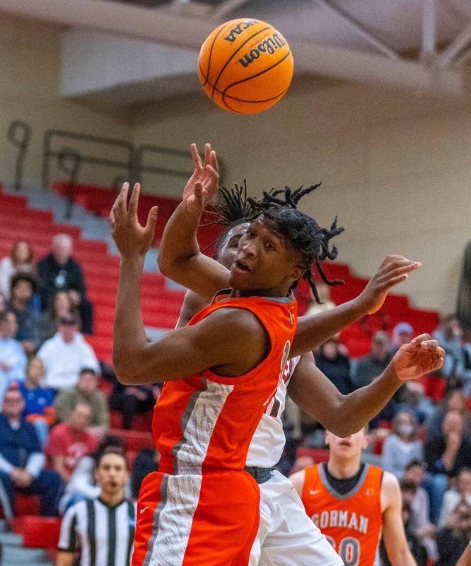 Bishop Gorman forward Jett Washington (2) has the ball poked away by Arbor View forward Brian & ...