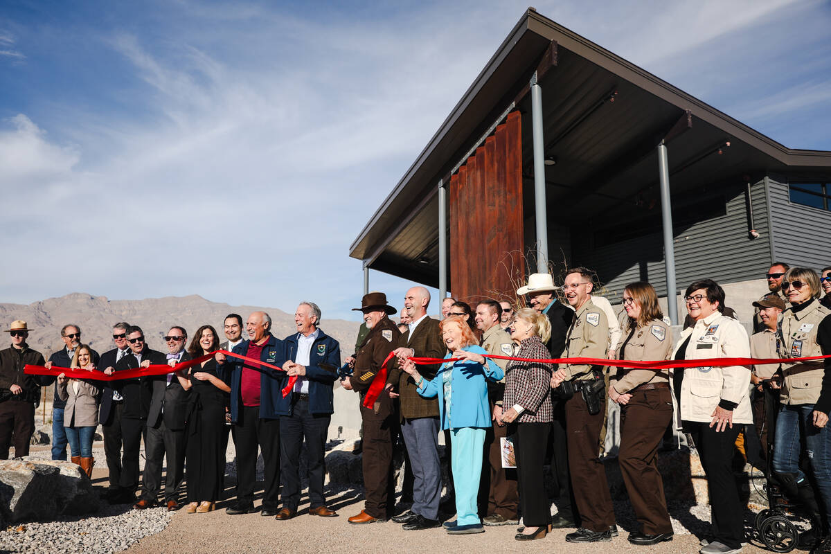 Local officials gather to cut the ribbon for the opening of Ice Age Fossils State Park in North ...