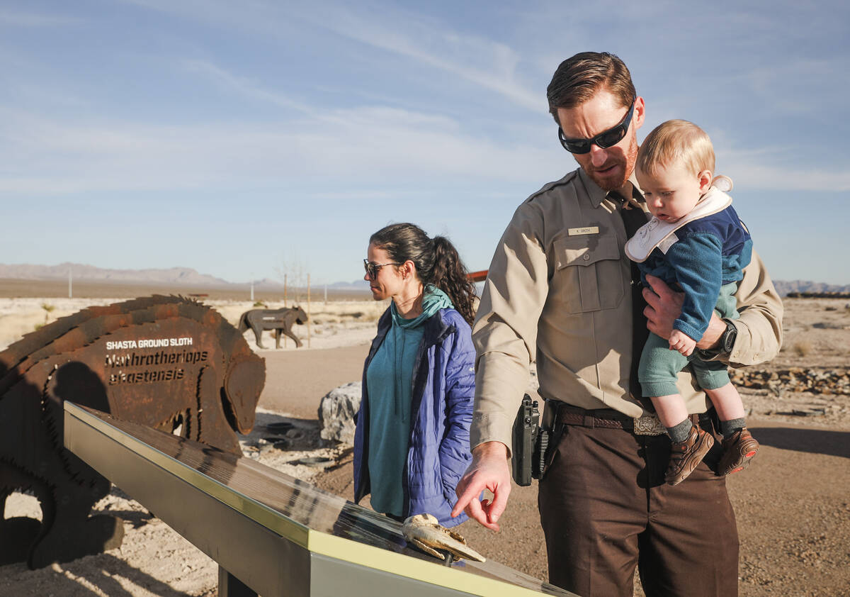 Kyle Groth, a ranger with Spring Mountain Ranch State Park, points out a sign and fossil to his ...