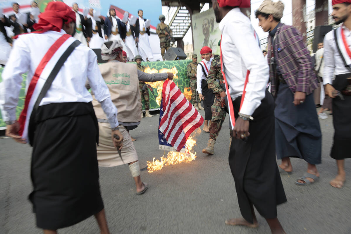 Houthi supporters burn a representation of the U.S. flag. (AP Photo/Hani Mohammed, File)