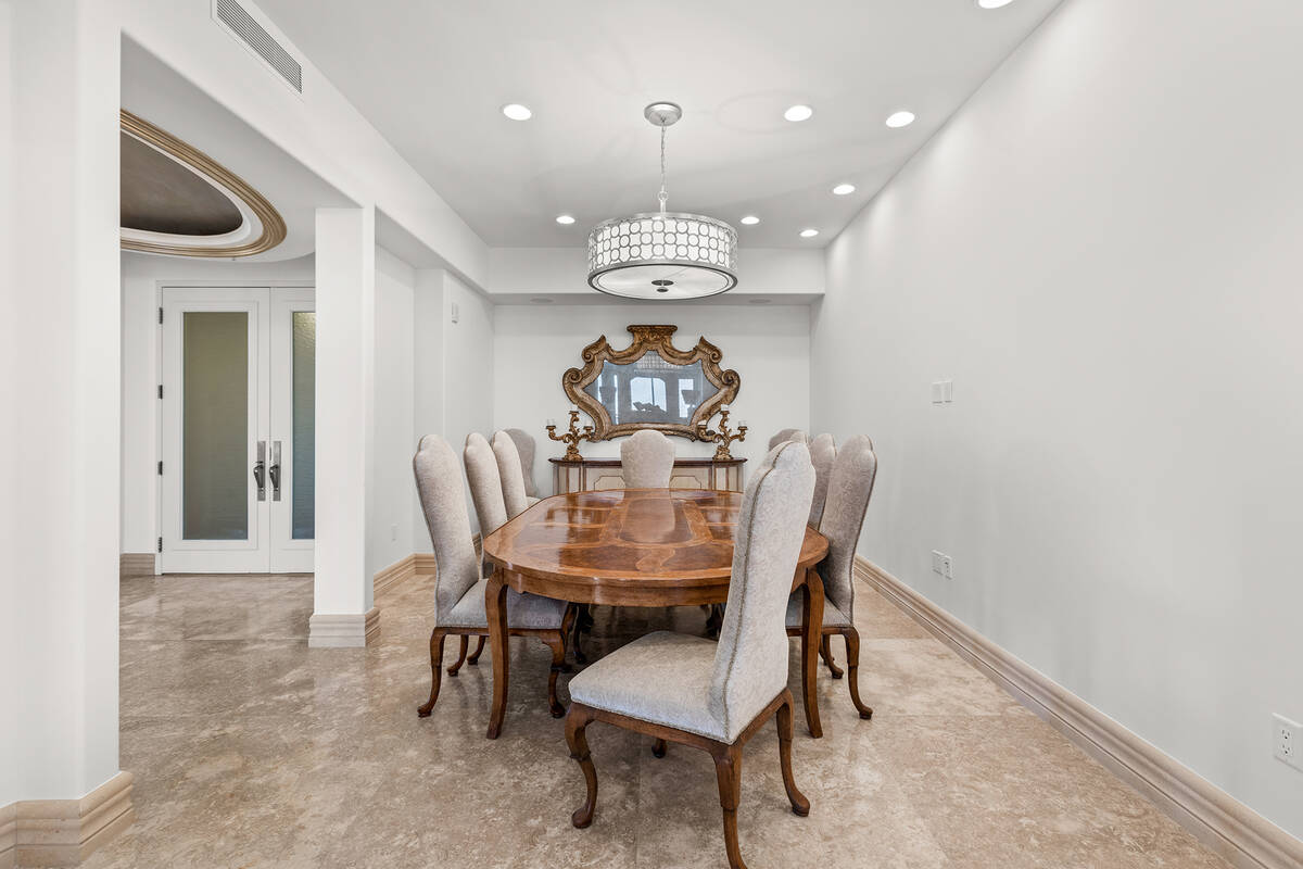 The One Queensridge Place penthouse features a formal dining room. (IS Luxury)