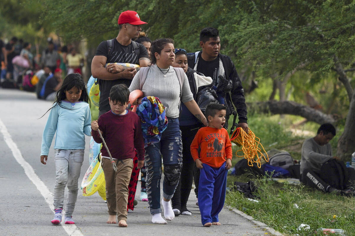 Migrants arrive to the Mexican side of the bank of the Rio Grande river in Matamoros, Mexico. ( ...