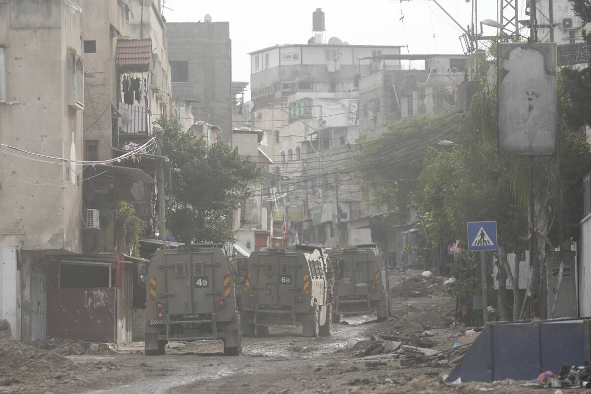 Israeli security forces are seen during a raid in the Tulkarem refugee camp, West Bank, Wednesd ...