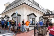 People line up outside of the Primm Valley Lotto Store to buy the Mega Million lottery tickets, ...