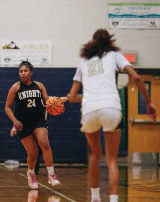 Democracy Prep guard Demi Thompson Lopez (24) dribbles the ball down the court during a game ag ...