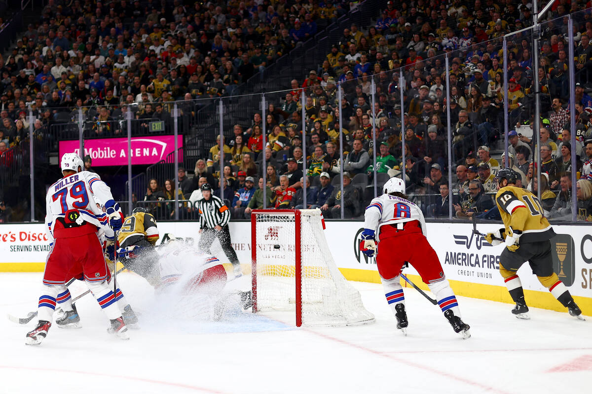 Golden Knights center Ivan Barbashev, center left, scores on Rangers goaltender Igor Shesterkin ...