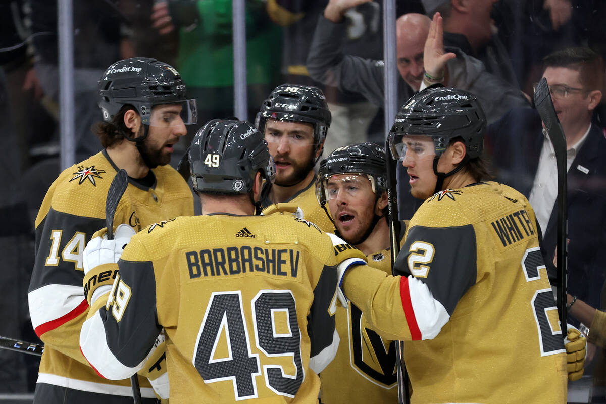 The Golden Knights gather around Golden Knights right wing Jonathan Marchessault (81) after he ...