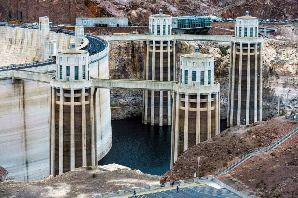 Cars cruise on Hoover Dam Access Road along the rim of the Hoover Dam at Lake Mead National Rec ...