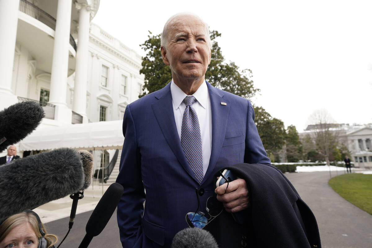 President Joe Biden speaks to the media before boarding Marine One on the South Lawn of the Whi ...