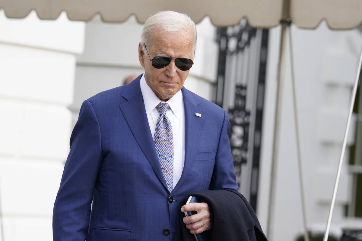 President Joe Biden walks to speak to the media before boarding Marine One on the South Lawn of ...