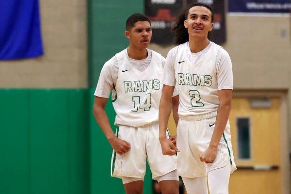 Rancho’s Jakoi Lide (2) and Caleb Roston (14) celebrate during the final seconds as they ...
