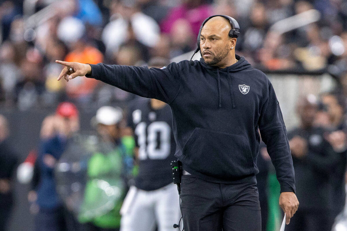 Raiders interim head coach Antonio Pierce reacts to a play during the first half of an NFL game ...