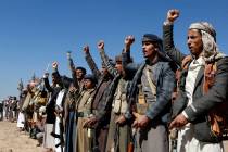 Houthi fighters and tribesmen stage a rally against the U.S. and the U.K. strikes on Houthi-run ...