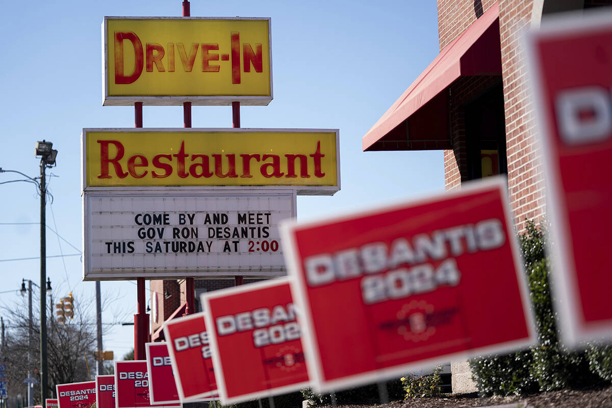 Campaign signs are mounted outside an event for Republican presidential candidate Florida Gov. ...