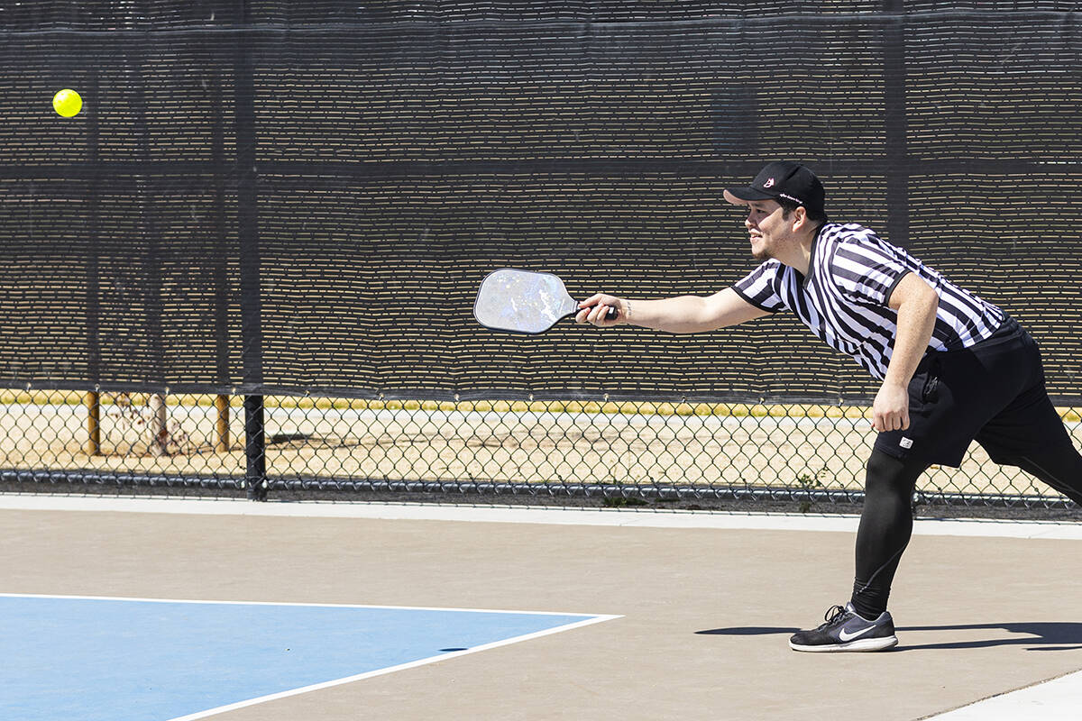 Caleb Ritua, of Las Vegas, plays pickleball at the Sunset Park pickleball complex on Tuesday, A ...
