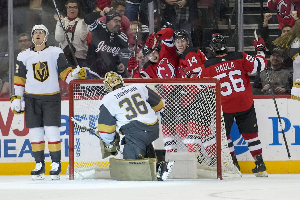 Vegas Golden Knights goaltender Logan Thompson (36) watches as New Jersey Devils center Curtis ...