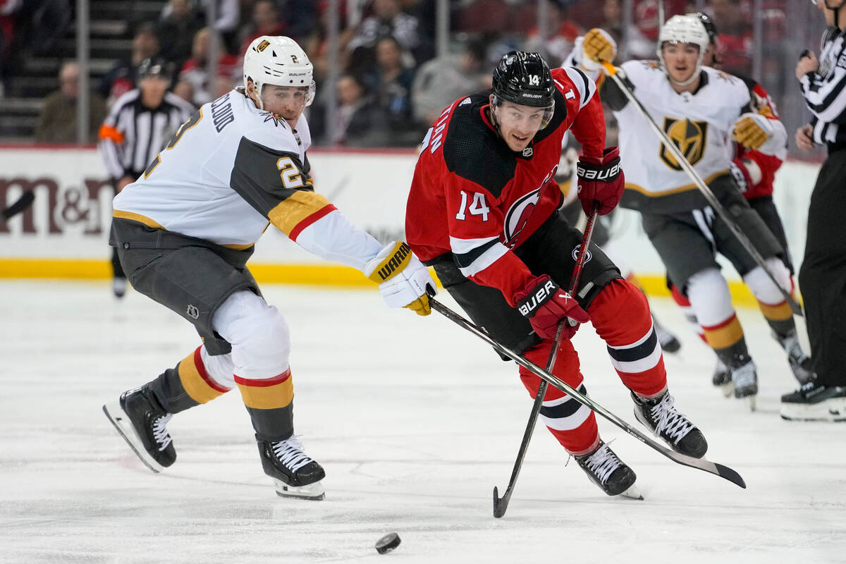 New Jersey Devils right wing Nathan Bastian (14) skates against Vegas Golden Knights defenseman ...