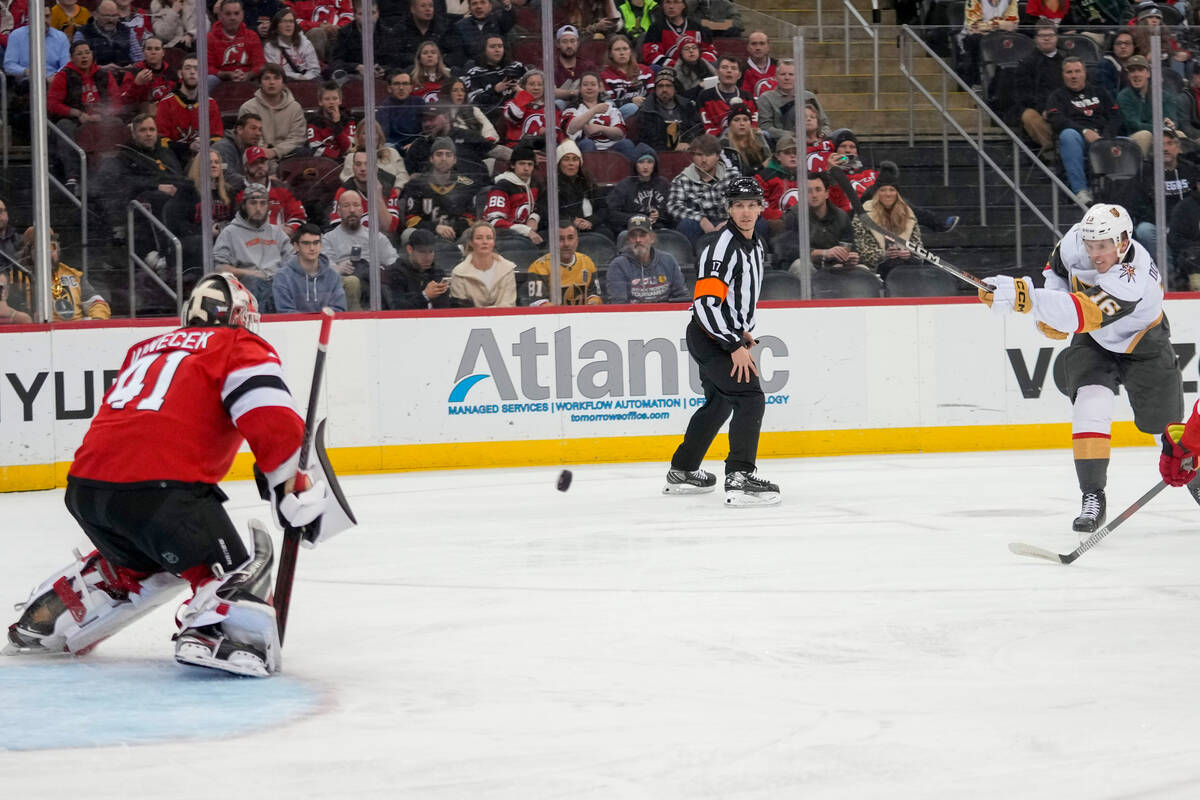 Vegas Golden Knights left wing Pavel Dorofeyev (16) shoots to score past New Jersey Devils goal ...