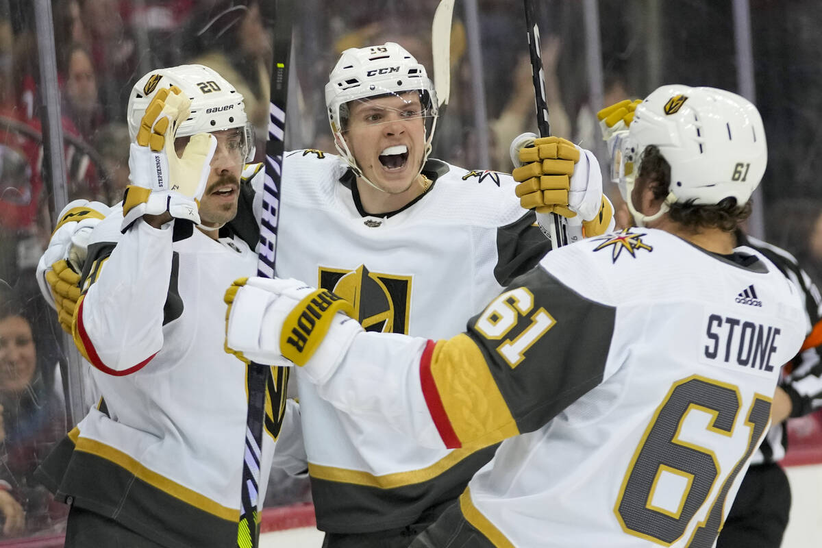 Vegas Golden Knights left wing Pavel Dorofeyev, center, celebrates after scoring against the Ne ...