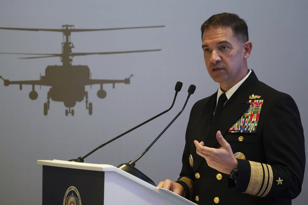 U.S. Navy Vice Adm. Brad Cooper, who heads the Navy's Bahrain-based 5th Fleet, speaks at an eve ...