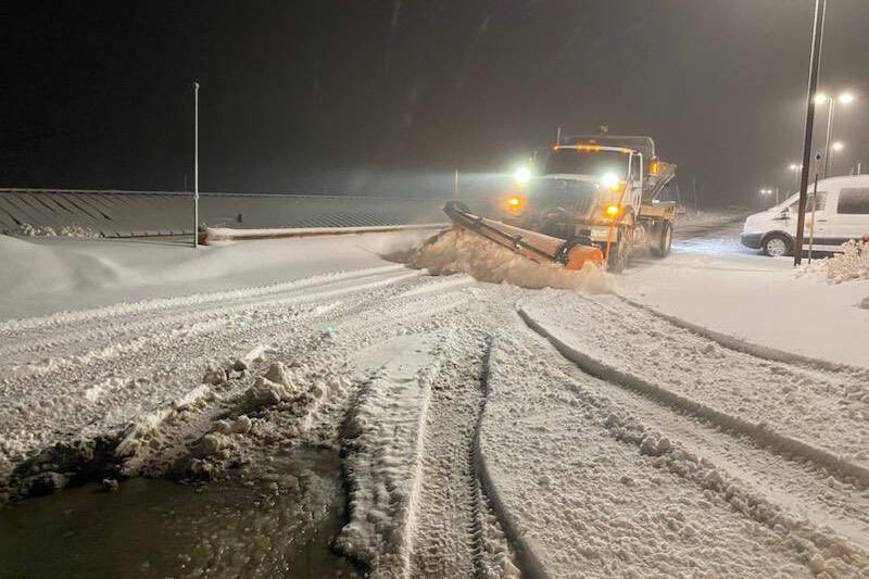 Clark County Department of Public Works employees plow snow from roads in the Kyle Canyon area ...