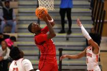 Coronado's Lantz Stephenson (5) shoots against Mojave forward Avondre Smith (50) and guard Nath ...