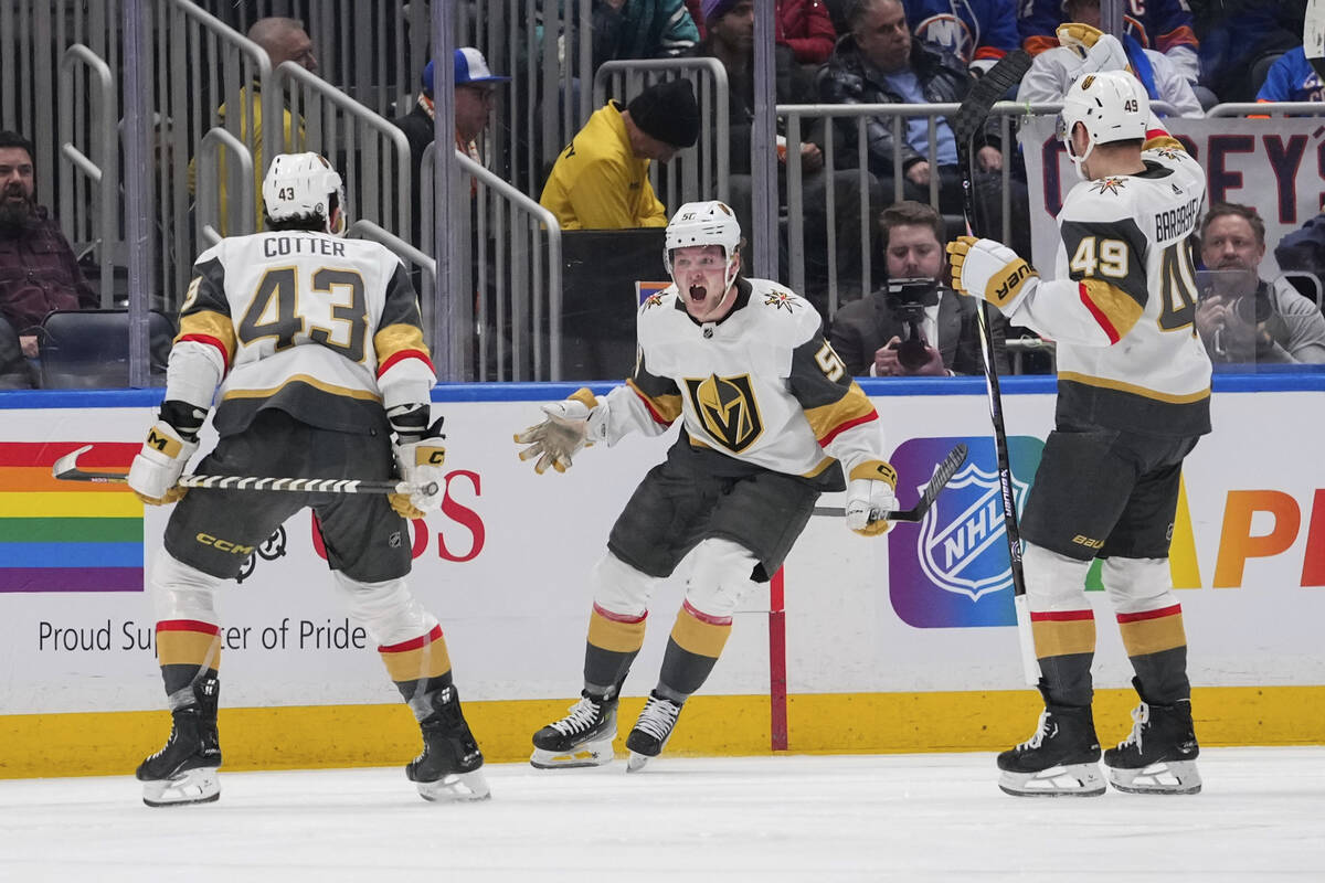 Vegas Golden Knights' Sheldon Rempal, center, celebrates with Paul Cotter, left, and Ivan Barba ...