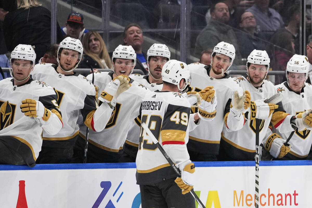 Vegas Golden Knights' Ivan Barbashev (49) is congratulated for his goal against the New York Is ...