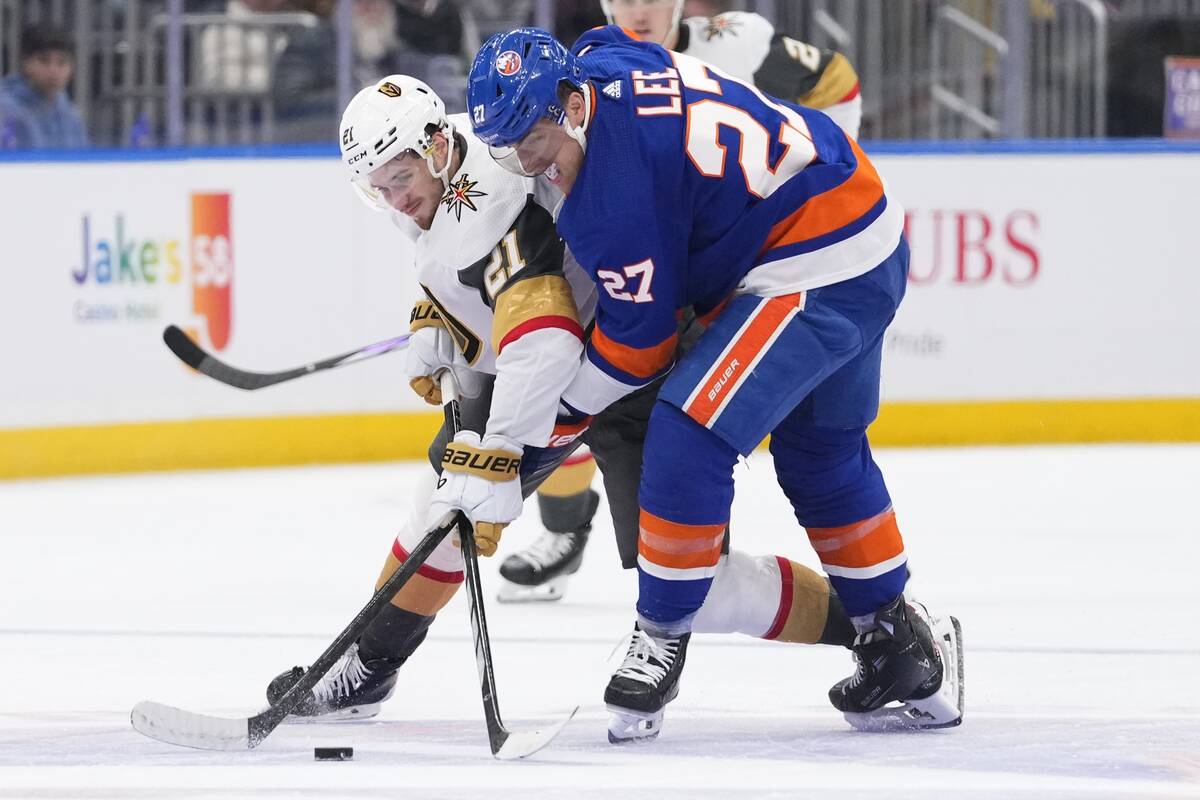 New York Islanders' Anders Lee (27) competes for control of the puck against Vegas Golden Knigh ...