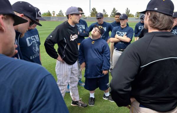 College of Southern Nevada baseball team manager Matty Cutler, center, listens as assistant coa ...