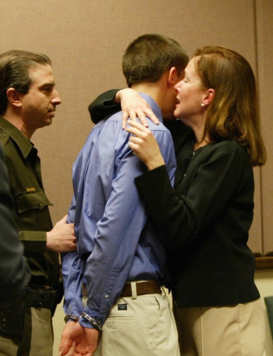 Sean Larimer is comforted by his mother Susan Larimer as he is taken into custody Monday, Jan 5 ...