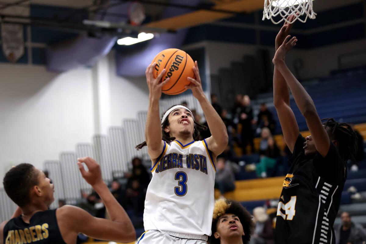 Sierra Vista guard Khamari Taylor (3) shoots against Clark forward Werrason Bakindo (24) during ...