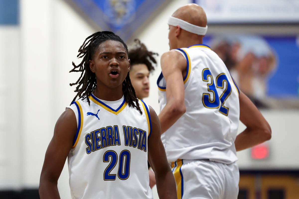 Sierra Vista forward Darius Ruffin (20) celebrates during the first half of a high school baske ...