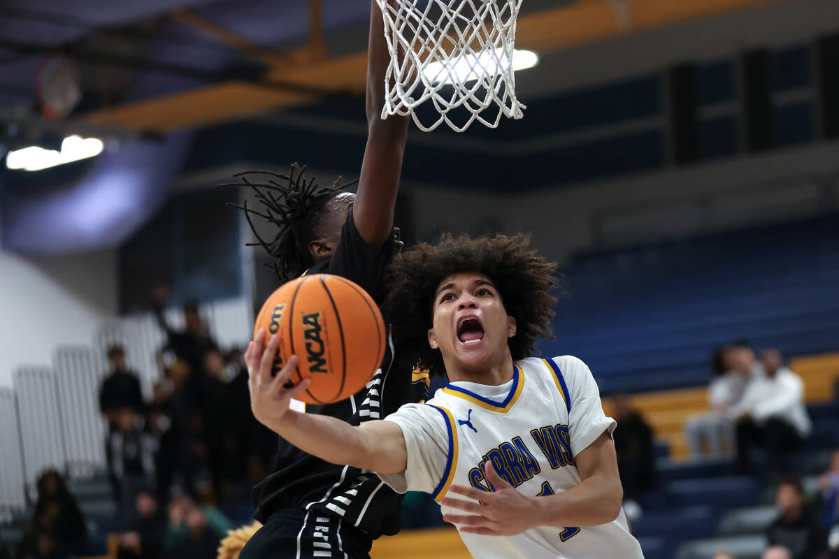 Sierra Vista guard Antonio McCraven (1) shoots against Clark forward Werrason Bakindo (24) duri ...