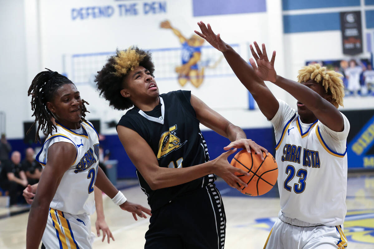 Clark guard Elijah Coleman (11) loses control of the ball while Sierra Vista forward Darius Ruf ...