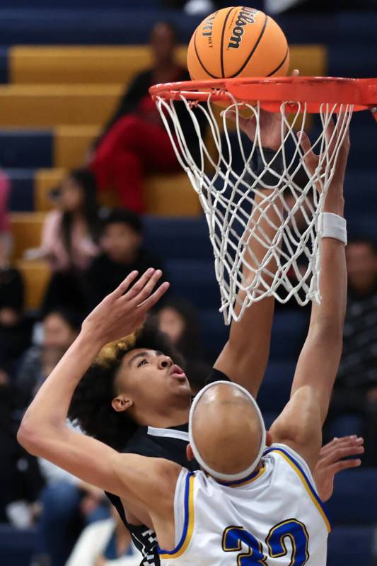 Clark guard Elijah Coleman (11) shoots against Sierra Vista center Xavion Staton (32) during th ...