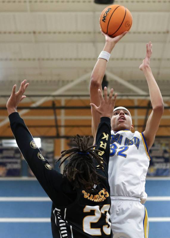 Sierra Vista guard Khamari Taylor (3) shoots against Clark forward Alan Anderson (23) during th ...