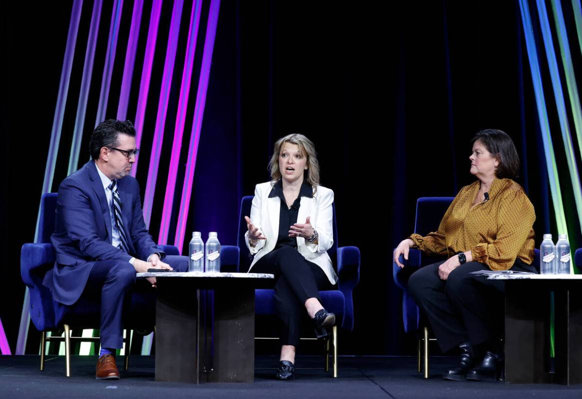 Renee Wilm, center, CEO of the Las Vegas Grand Prix, speaks as Betsy Fretwell, right, COO, Las ...