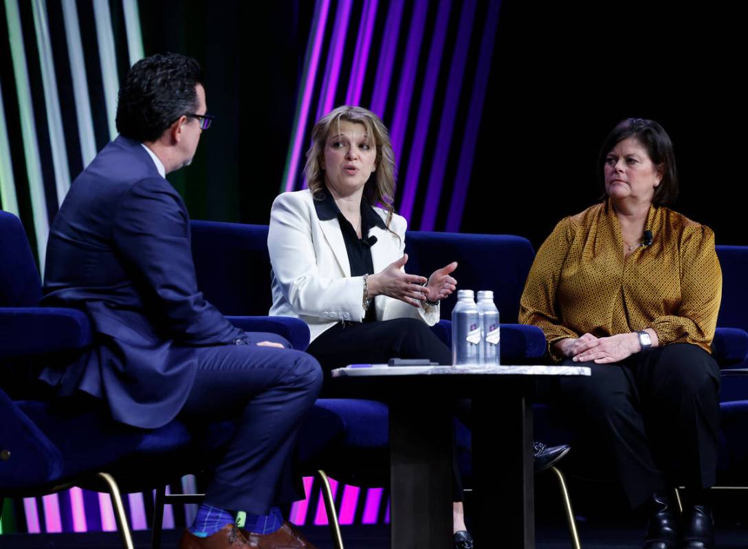 Renee Wilm, center, CEO of the Las Vegas Grand Prix, speaks as Betsy Fretwell, right, COO, Las ...