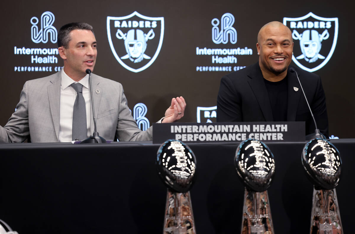 Tom Telesco, left, and Antonio Pierce joke about Week 15 Raiders-Chargers score as they are int ...