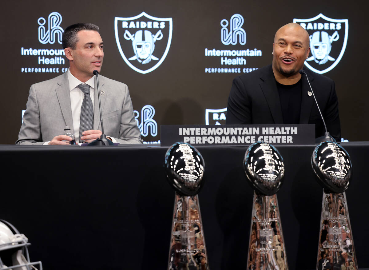 Tom Telesco, left, and Antonio Pierce are introduced as general manager and coach during a pres ...