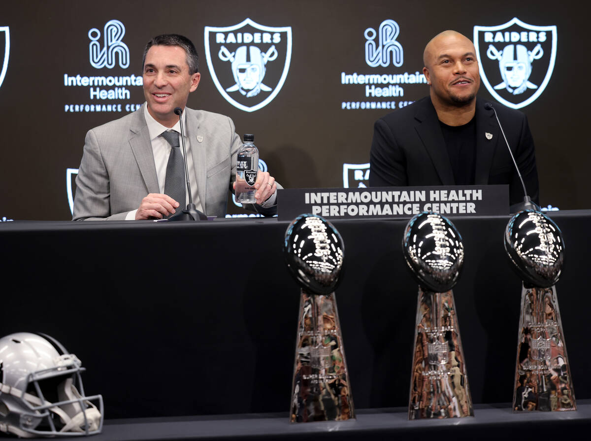 Tom Telesco, left, and Antonio Pierce are introduced as general manager and coach during a pres ...