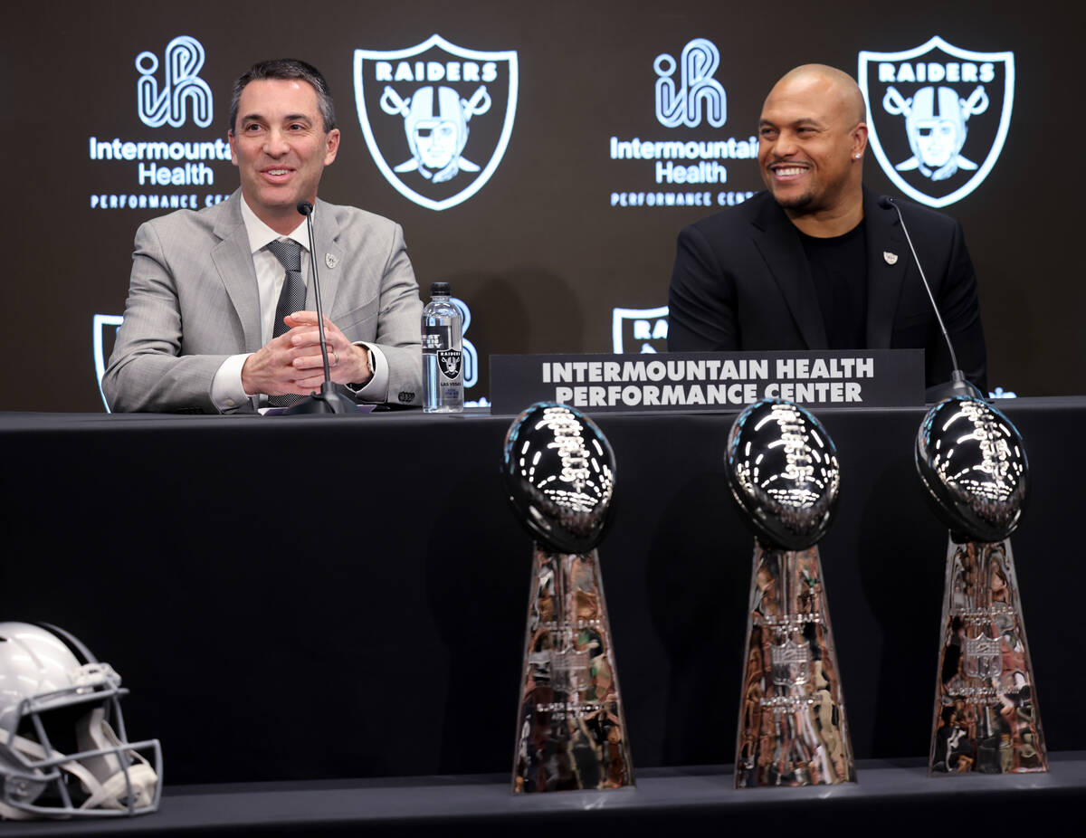 Tom Telesco, left, and Antonio Pierce are introduced as general manager and coach during a pres ...