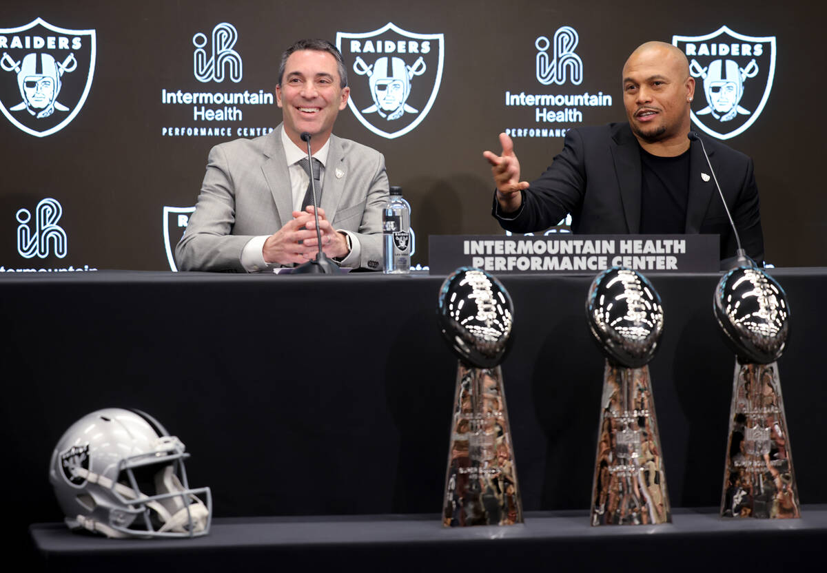 Tom Telesco, left, and Antonio Pierce are introduced as general manager and coach during a pres ...