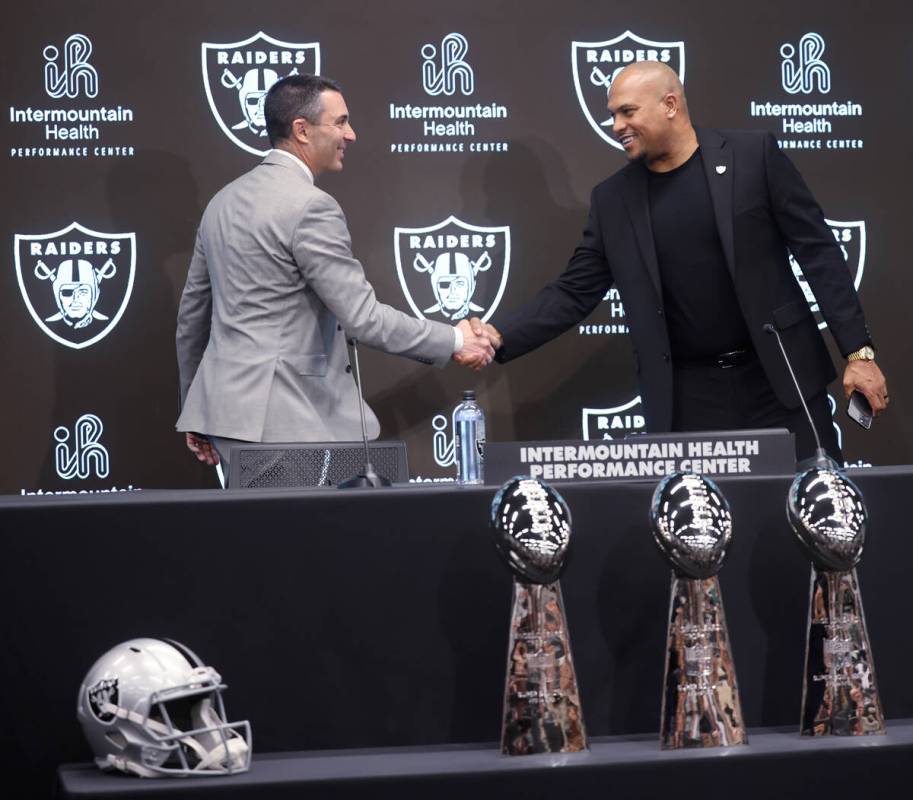 Tom Telesco, left, and Antonio Pierce are introduced as general manager and coach during a pres ...