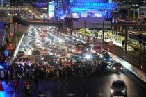 Israeli protesters block a highway during a protest demanding the immediate release of the Isra ...