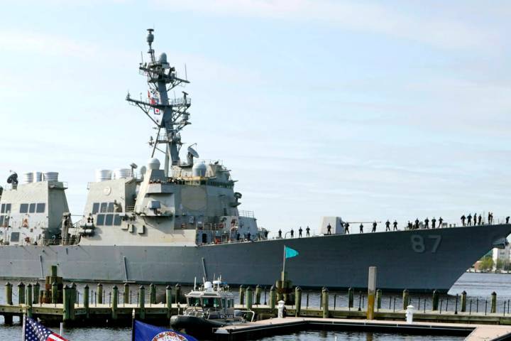 File - The USS Mason, an Arleigh Burke-class destroyer, passes a dock in Norfolk, Va., April 8, ...