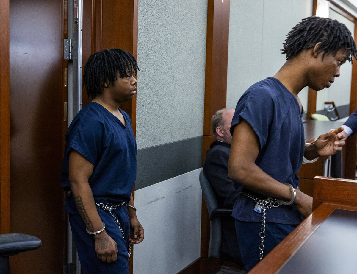 Defendants Gianna Robinson, left, and Dontral Beaver enter the courtroom in the Rancho High bea ...
