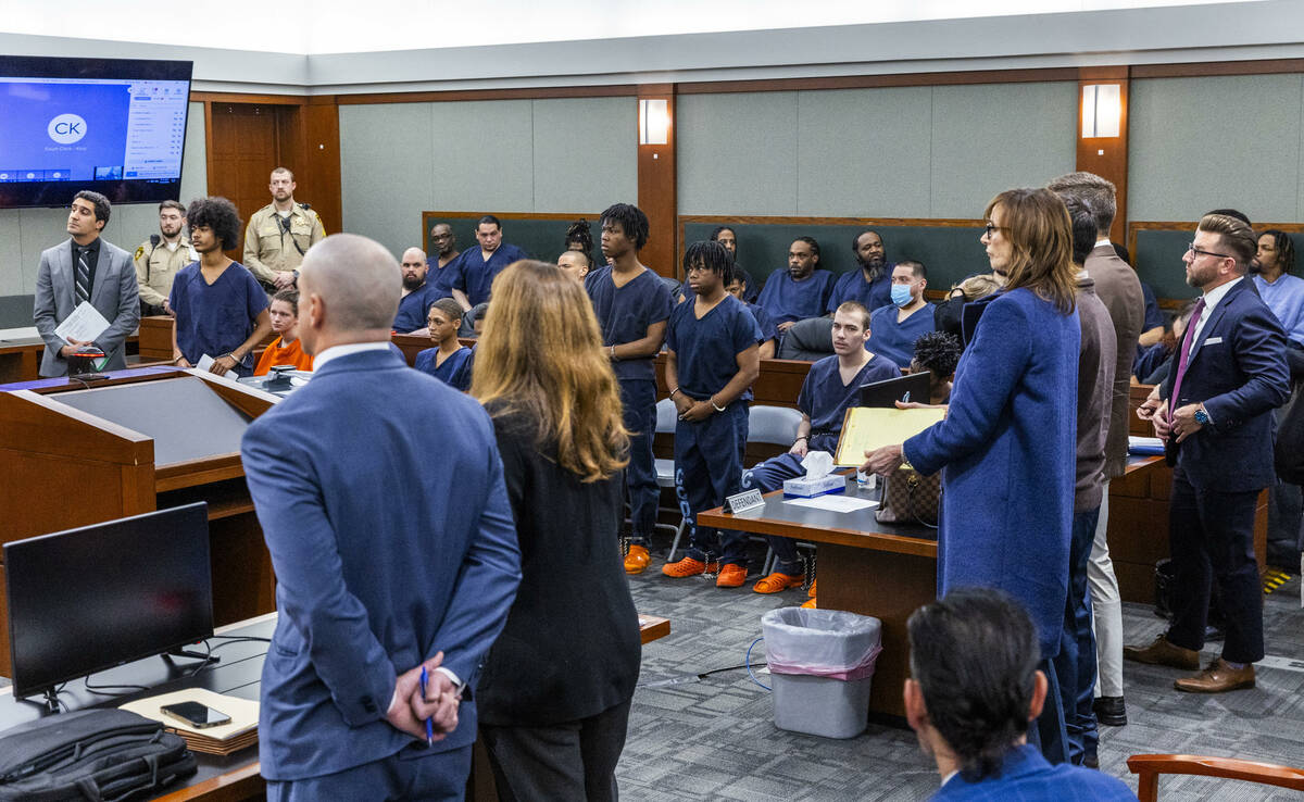 Defendants and their attorneys stand while answering questions by Judge Tierra Jones in the Ran ...