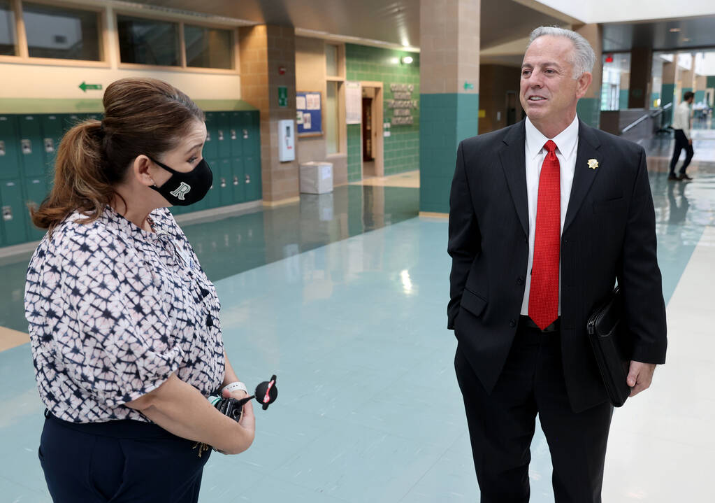 Then-Clark County Sheriff Joe Lombardo meets with Principal Darlin Delgado before announcing hi ...